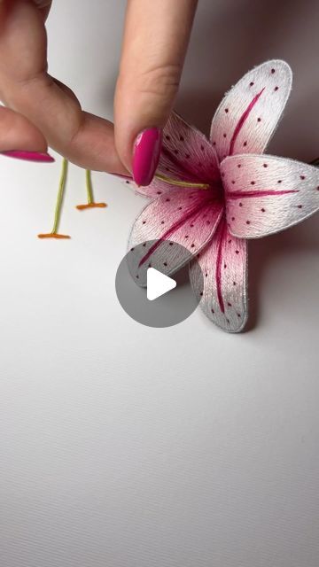 Lucy Martin on Instagram: "The final part of constructing the hand embroidered lily…adding some stamen 💗 I absolutely love this part of creating lilies! It’s where the piece really comes to life Who’s excited for this kit to launch? 💓 #lily #stargazerlily #handembroidery #handembroidered #spring #floral #goldworkembroidery #stumpworkembroidery #handandlock #nature #stitch #sewing #embroidery #embroideryart #embroiderystitches #embroideryinspiration #embroiderydesign #embroidered #rsn #artistsoninstagram #threadpainting #silkshading #florals #flowers #embroiderykit #embroiderykits #embroiderytutorial #tutorials #kits #craft" Embroidered Lily, Lily Embroidery, Surface Decorations, Gold Work Embroidery, Stitch Sewing, Stargazer Lily, Surface Decoration, Thread Painting, Sewing Embroidery