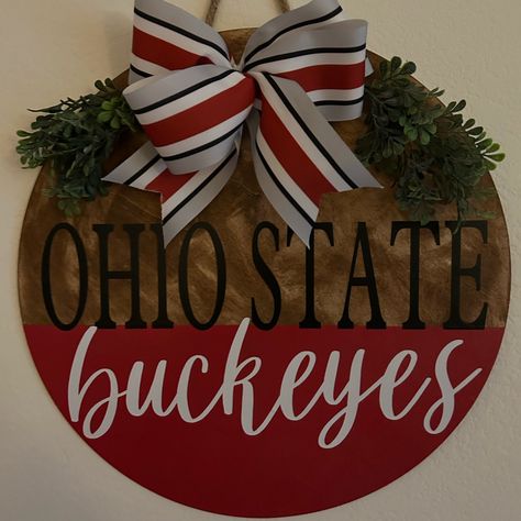 18 Inch Ohio State Buckeyes Door Hanger Stained , Painted And Protected For Outdoor Use. This Will Look Amazing On Your Door Or Will Make A Great Gift. Greenery And Bow May Vary And Back Is Not Finished. Ohio State Buckeye Wreath, Michigan Door Hanger, Ohio State Buckeyes Door Hanger, Husker Door Hanger, 49ers Door Hanger, Girly Door Hanger, Sports Door Signs, Wooden Mason Jar Door Hanger, College Door Hangers