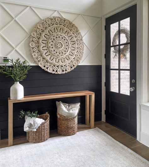 Greeted by a striking black entrance door, this farmhouse-styled entryway draws attention with its bold black-and-white shiplap design. An artfully hung large woven circular artwork rests above the wooden table with plants and woven baskets. Entryway Wall, Entry Way Design, Home Entrance Decor, Decoration Inspiration, Updating House, Decor Home Living Room, Front Room, New Wall, First Impression