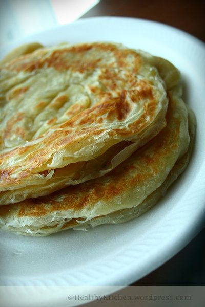 Malaysian roti canai (RATED: 9/10)  This recipe is quite difficult, but the results were encouraging! I definitely want to try this again, as the shaping of the dough is tough the first couple times. It took 3 hours to make the dough, and about 1 hour to cook the bread. Super nostalgic taste and awesome with curry or Dahl! Making Roti, Roti Canai Recipe, Leavened Bread, Masakan Malaysia, Roti Canai, Pembuat Roti, Malaysian Cuisine, Roti Recipe, Vegetarian Menu