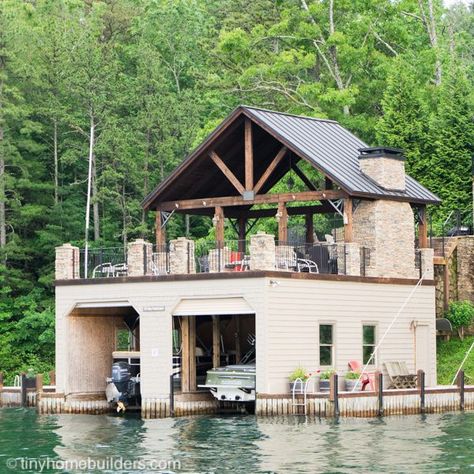 Boathouses to Inspire Your Tiny House Design - Tiny Home Builders 2 Story Boat Dock, Boat Garage On Water, Boat Slip Ideas Lake Houses, 2 Story Boat House, Boat Houses And Docks, Boat Lifts And Docks, Boat House Ideas Lakes, Boat House Design, Boat House Ideas