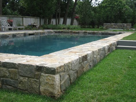 Swimming pool with built-in seat wall.  The design intent was to mimic the foundation of an old building. Hillside Pool, Beach House Pool, Small Inground Pool, Seat Wall, Pool Inspiration, Building A Swimming Pool, Pools Backyard Inground, Stone Pool, Indoor Water Fountains