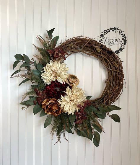 "Give your door a touch of outdoor beauty with this Fall Wreath. This wreath features green, fabric eucalyptus leaves with tiny plastic, cream-white and subdued purple flower buds for a realistic look. Features real touch dahlias, rose, ranunculus and a peony. Add it to any door or wall space. The design makes a perfect embellishment for any room. Made on a sturdy 18\" grapevine wreath base. Finished wreath measures approx. 22 inches in diameter. ~Premium-quality materials & craftsmanship preser Dahlia Christmas Wreath, Grape Vine Wreath Fall, Grapevine Wreath Ideas, Rope Wreaths, Fall Floral Wreath, Macrame Wreath, Fall Wreaths For Front Door, Diy Floral Wreath, Fall Decor Wreaths