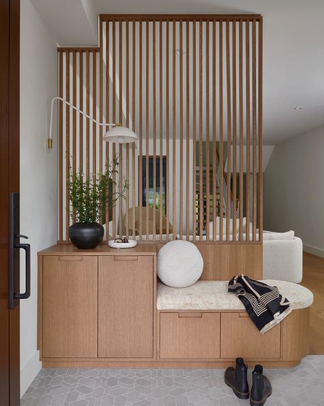 Project Sherwood Park by Four Blocks South front entry bench and slat screen | Portfolio Front Entry Bench, Slatted Walls, Accent Wall In Kitchen, Modern Foyer, Modern Room Divider, House Staircase, Home Hall Design, Divider Design, Living Hall