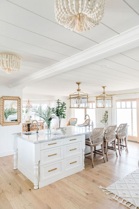 How to Add Coastal Chic Style to Your Home - The Leslie Style Coastal Layered Rugs, Coastal Open Floor Plan, Chic Beach House Coastal, Coastal House Flooring, Coastal Laminate Flooring, Coastal Chic Design, Grand Millennial House Exterior, Coastal Modern Beach House, Coastal Great Room Ideas