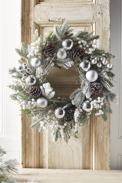 frosted pine wreath with shiny and matte silver balls, frosted pinecones and white berry picks White Pinecone Wreath, Christmas Wreaths Silver, Silver Wreath Christmas, Decorate Christmas Wreath, Christmas Wreaths White, White Christmas Wreath Ideas, Silver Christmas Wreaths, Silver Pinecones, Silver Wreaths