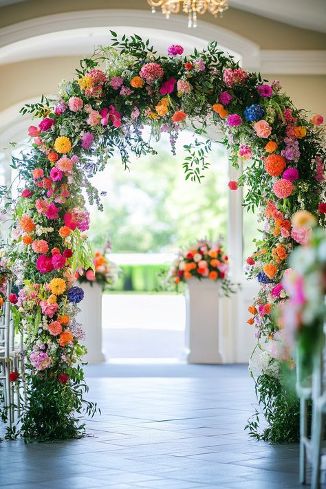 80+ Stunning Ideas for Your Wedding Flower Arch | Matched Hearts Bright Floral Wedding Arch, Bright Floral Arch, Wedding Archway Flowers, Wedding Arch Ideas Flowers, Colorful Flower Arch, Diy Flower Arch Wedding, Hexagon Wedding Arch Flowers, Wildflower Wedding Arch, Summer Wedding Arch