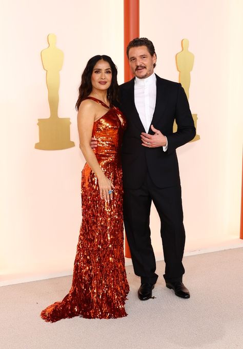 Our favourite unexpected celebrity pairing on the 2023 Oscars red carpet was none other than Salma Hayek and Pedro Pascal.

Salma wore a shimmering flame coloured gown by Gucci, while Pedro opted for a bow tie-less tux. Salma Hayek Daughter, Pedro Pascal Joel Miller, The Oscars 2023, Pedro Pascal Joel, Pedro Pascal Oscar Isaac, Pedro And Oscar, 2023 Oscars, Spider Man Andrew Garfield, Sarah Polley