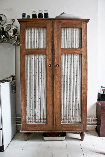 an old armoire used in the kitchen with adorable fabric to cover the glass panes to hide clutter brilliant! 아파트 인테리어, Home Fashion, 인테리어 디자인, A Kitchen, Cottage Style, Home Deco, Vintage Furniture, Painted Furniture, Cupboard