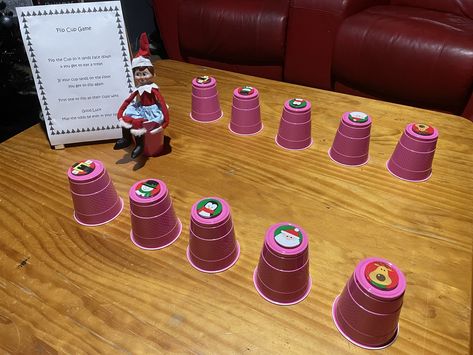 Elf Cup Game, Ornament In Cup Game, Elf On The Shelf Reindeer Pudding Cups, Elf On The Shelf Red Solo Cups, World's Best Cup Of Coffee Elf, Cup Games, Plastic Cup, Elf On The Shelf, Elf