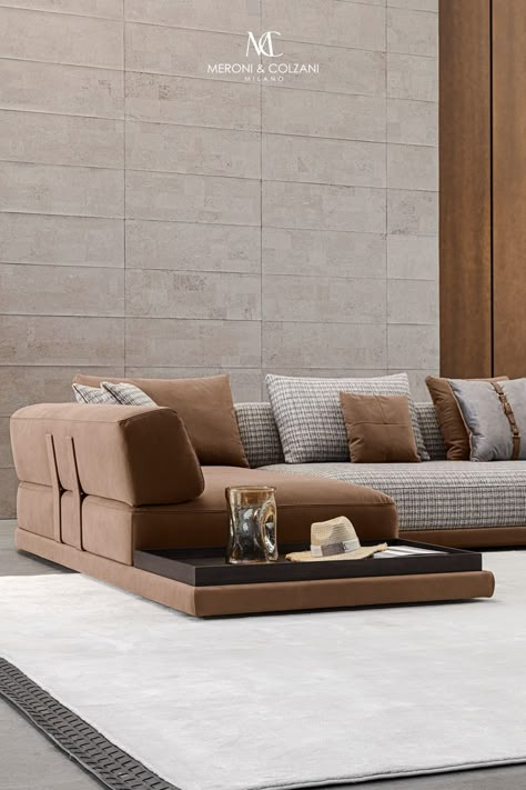 The Mediterraneo sofa comprises a leather base, a soft seat and a rounded structure that acts as a backrest and armrest. The sofa features leather-covered metal designer elements that support the entire structure while lending it a distinctive character. The Mediterraneo sofa is available in a variety of finishes and sizes, and also features modules with a built-in side table. Be amazed by the combination of materials and colours of its finishes.    Design: Cesare Arosio Elegant Sofa Luxury Modern, Built In Sofas, Italy Living Room, Italy Living, Built In Sofa, Statement Sofa, Sofa Inspiration, Sofa Seating, Elegant Sofa