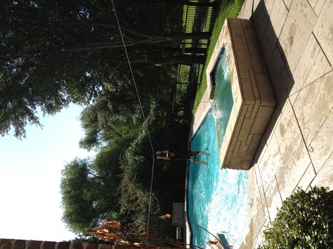 Zipline over pool-- oh my goodness!  They LOVE it! Zip Line Backyard, Pool Remodel, Zip Line, Dream Pools, Oh My Goodness, Backyard Fun, Pool Ideas, Outdoor Oasis, Pool Designs