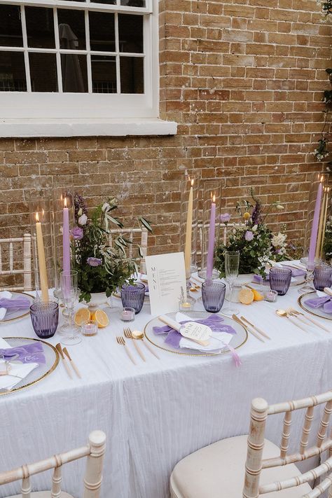 Table Decor Lilac Yellow Candles Flowers Shotesham Park Wedding By Emma Olivia Photography #wedding #weddingdecor Park Wedding Ideas, Lilac Wedding Themes, Purple Wedding Tables, Light Purple Wedding, Purple Wedding Decorations, Dappled Sunlight, Candles Flowers, Candle Table Decorations, Violet Wedding