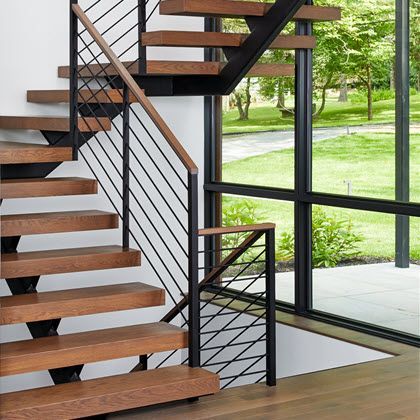 Floating stairs with horizontal round bar railing and wood treads. Bar Railing, Balcony Exterior, Stainless Steel Staircase, Custom Stairs, Round Stairs, Outside Stairs, Interior Railings, Modern Gate, Bar Rail