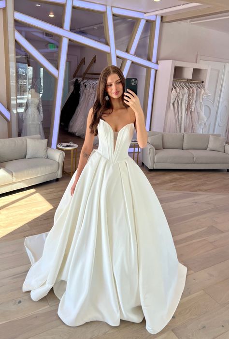 Derrick by Maggie Sottero is drama! With a plunging v-neckline and exposed boning, this bold beauty is sure to make a lasting impression! #weddingdress #deepvneckline #ballgown Maggie Sottero Ballgown, Maggie Sottero Derrick, V Cut Wedding Dress, Beautiful Ballgown, Strapless Wedding Dress Ballgown, Plunging Neckline Wedding Dress, Wedding Ballgown, 2026 Wedding, Maggie Sottero Bridal