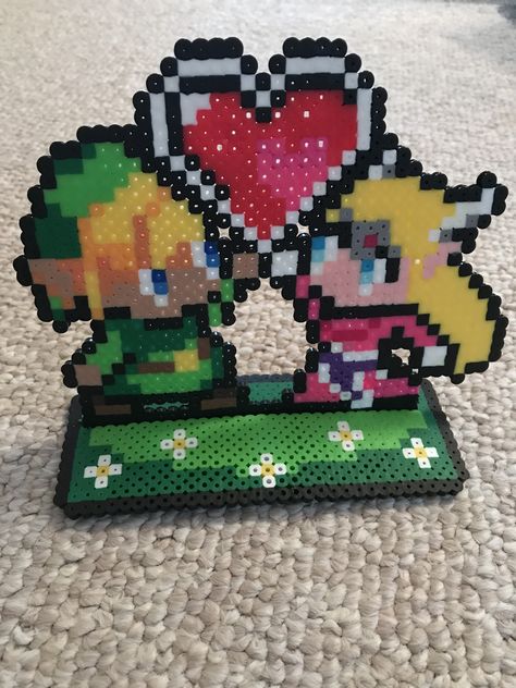 Standing Perler Beads, Perler Bead Stand Pattern, Link Perler Beads Pattern, Link And Zelda Pixel Art, Zelda Beads Pattern, Zelda Perler Bead Patterns, Perler Bead Heart, Zelda Pixel Art, Zelda Melty Beads