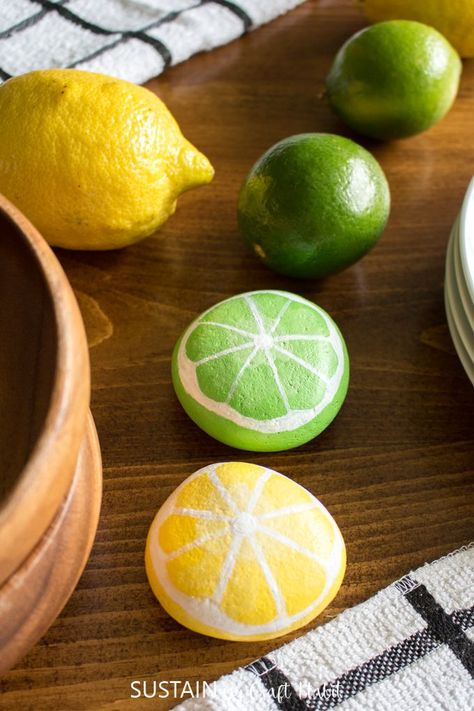 Add some unexpected citrus decor to your home this Summer with these quick and easy to paint lemon and lime painted rocks. Paint Lemon, Citrus Decor, Lemons And Limes, Easy To Paint, Diy Rock Art, Lime Paint, Rocks Painted, Rock Painting Ideas, Stone Art Painting