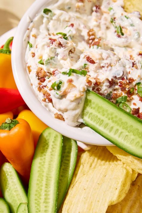 This High Protein Crack Dip recipe is perfect for the pool, parties, and snacking. It features a blend of Greek yogurt, ranch seasoning, cheddar cheese, crispy bacon, and green onions. A healthier twist on a classic favorite, it pairs perfectly with chips, crackers, or fresh veggies. This recipe is low carb and gluten-free and can also be tailored or be dairy-free. High Protein Chip Dip, High Protein Veggie Dip, Protein Fiber Meals, Low Calorie Crackers, Holiday Party Meals, Macro Meal Prep, Easy Protein Pancakes, Fiber Meals, Yogurt Ranch