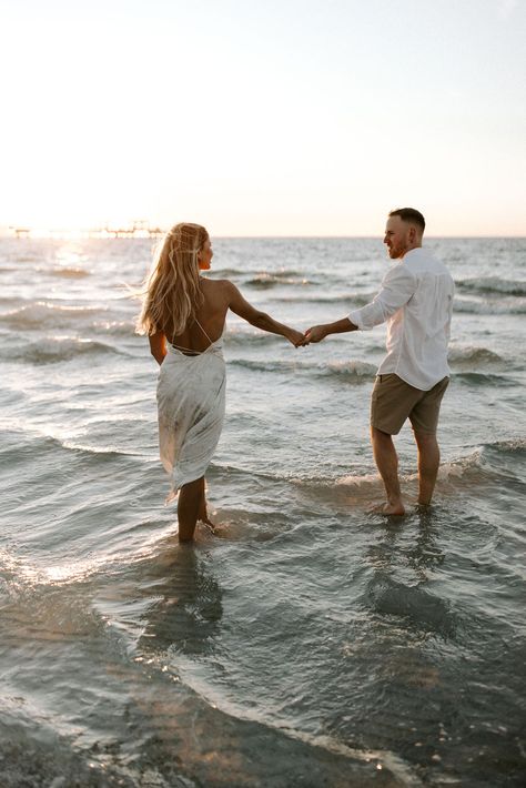 The most dreamy beach engagement session! If you have been considering taking engagement photos at the beach, this is your sign!  --- beach engagements, beach photoshoot, couples session, Florida couple, Florida engagement, proposal, Florida photographer, Tampa Florida, photography, engagement outfits, wedding photographer, Lightroom presets, presets, warm, timeless photos, dreamy photos, photo Inspo. Formal Beach Engagement Photos, Lake Beach Photoshoot, Timeless Engagement Photos Beach, Beach Engagement Photos White Dress, Sunrise Engagement Pictures Beaches, Canon Beach Engagement Photos, Beach Engagement Photos Casual, Beach Sunset Photoshoot Couple, Beach Proposal Outfits