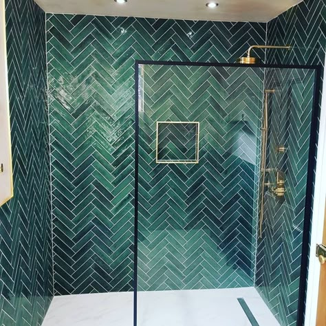 Green bathroom tile, herringbone, brass shower fixtures, wetroom base, porcelain floor. Forest Green Bathroom Tile, Green And White Downstairs Toilet, Green Herringbone Bathroom Tiles, Bathroom With Green Tile Walls, Green Herringbone Shower Tile, Green Wood Bathroom Ideas, Emerald Green Tiled Bathrooms, Green Tile Wet Room, Emerald Green Tile Shower Ideas