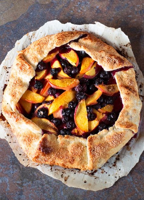 Peach and Blueberry Galette Peach Galette, Mary Berry Pear And Blueberry Galette, Puff Pastry Peach Galette, Peach Blueberry Galette Recipe, Summer Berry Galette, Peach Blueberry Galette, Rustic Blueberry Galette, Peach Galette Recipe, Blueberry Delight