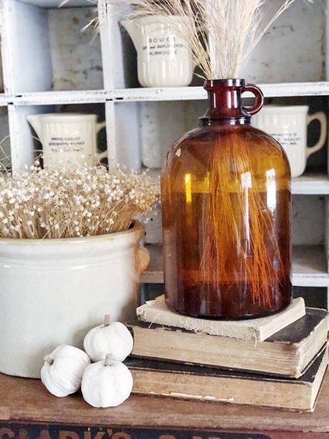 Glass Jugs Decor Ideas, Porch Styling Ideas, Glass Jugs Decor, Porch Styling, Kids Craft Projects, Glass Bottle Decor, Books Stacked, Aesthetic Craft, Jug Decor