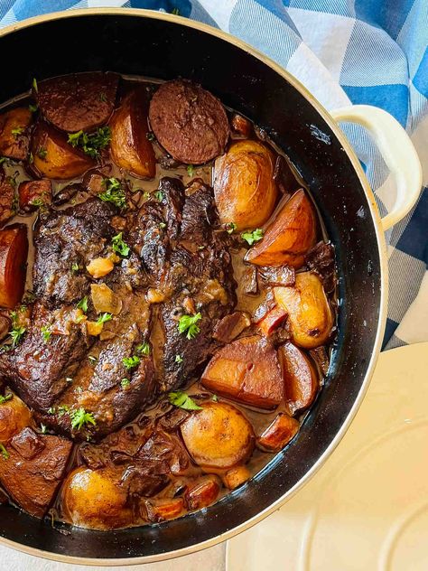 Braised chuckled roast in Dutch oven surrounded by vegetables and rich red wine and beef stock reduction. Chuck Roast Recipes In Dutch Oven, Stove Top Chuck Roast, Braised Chuck Roast Dutch Ovens, Chuck Roast Recipe Oven, Braised Chuck Roast, Chuck Roast Recipe, Cross Rib Roast, Dutch Oven Pot Roast, Blade Roast