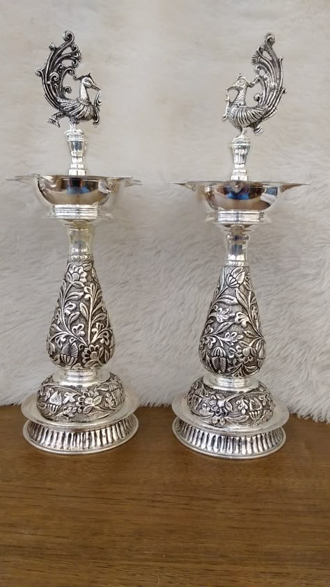 Mahalaxmi gold and diamond merchants 92.5 Silver Antique peacock 🦚 kuthu vilakku Grams - 958.570 Worldwide shipping available Customer care number - 9283 916 916 Silver Deepam Design, Silver Deepam, Silver Lamps, Silver Home Accessories, Silver Articles, Emerald Stone Rings, Golden Sparkle, Pooja Items, Pooja Mandir