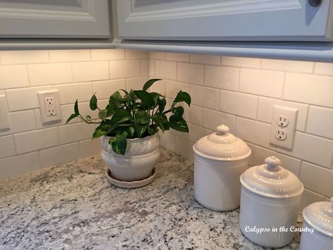 White Ice Granite and undercabinet lighting White Ice Granite Countertops, White Ice Granite, Undercabinet Lighting, White Cabinets White Countertops, White Granite Countertops, Cleaning Basket, Kitchen Countertop Materials, Kitchen Backsplash Designs, Granite Countertop