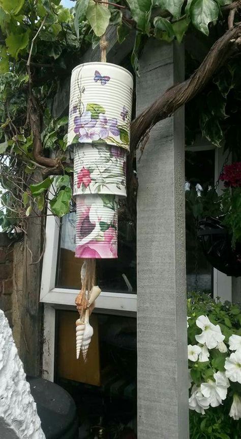 Tin can wind chimes by jeanne hildrew decoupage uk Can Wind Chimes Diy, Tin Can Crafts Garden, How To Make Wind Chimes Diy, Handmade Wind Chimes Crafts, Diy Wind Chimes Recycled, Tin Can Wind Chimes, Tin Cans Diy, Can Wind Chimes, Shell Chimes