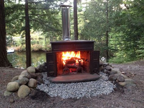 Franklin stove at camp Wood Stove Patio, Outdoor Woodstove Ideas, Franklin Wood Burning Stove, Outdoor Wood Stove, Franklin Stove, Cedar Patio, Stove Ideas, Outdoor Wood Burning Fireplace, Outdoor Fireplace Designs