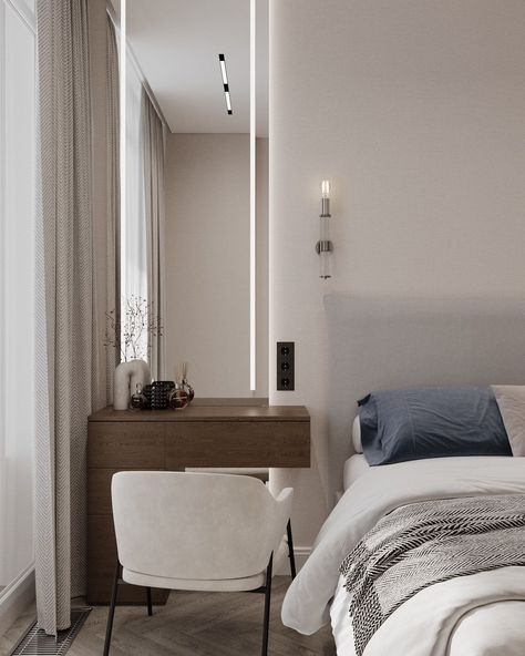 This bedroom is designed in a modern minimalist style with a neutral color palette that creates a sense of calm and coziness. The focal point is a large double bed with a soft headboard, adorned with pillows in various shades, from light beige to deep blue. The use of light, natural fabrics and bedding adds to the comfort of the space. The ceiling features recessed lighting panels that provide soft illumination, highlighting the elegant and understated design. On both sides of the bed, there... Soft Headboard, Storing Clothes, Modern Minimalist Style, Grey Bedroom, Neutral Color Palette, One Bedroom Apartment, Vanity Table, Contemporary Bedroom, Double Bed