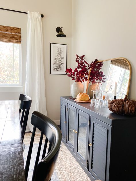 Black table with gold accents Cabinet Behind Dining Table, Buffet Cabinet In Front Of Window, Buffet Next To Fireplace, Dinning Room Buffet Cabinet Decor, Dresser As Buffet Dining Room, Decor Above Buffet In Dining Room, Buffet Table Decor Dining Room, Dining Room With Sideboard Buffet, Buffet Cabinet Decor Dining Rooms