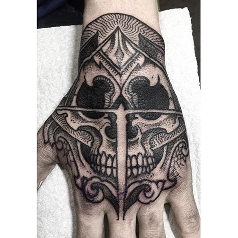 a skull tattoo on hand Fist Tattoo Ideas For Men, Hand Skull Tattoo, Skull Dotwork, Fist Tattoo, Tiger Hand Tattoo, Hand Skull, Tattoo Catalog, Skull Hand Tattoo, Skull Sleeve