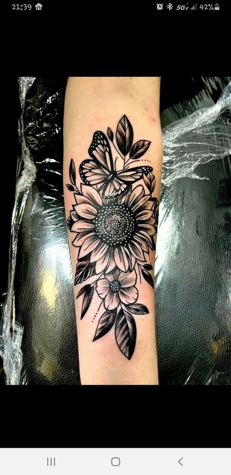 Black And Grey Sunflower Tattoo Forearm, Women Forearm Cover Up Tattoo, Sunflower Tattoos Sleeve, Sunflowers On Forearm Tattoo, Sunflower Tattoos Forearm, Sunflower Tattoo Shaded, Cover Up Sunflower Tattoo, Upper Arm Tattoo Cover Up Ideas, Sunflower And Butterfly Tattoo Sleeve