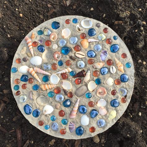 My son made a custom stepping stone for our butterfly garden using shells and glass beads from the craft store. Sea Glass Mosaic Diy Stepping Stones, Shell Stepping Stones, Diy Marble Crafts, Concrete Stepping Stones Diy, Glass Mosaic Diy, Marble Crafts, Yard Crafts, Concrete Creations, Mosaic Stepping Stone