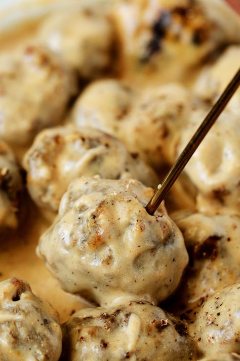 A swedish meatball with a cocktail skewer in it. New Years Meatballs, Christmas Meatballs Crockpot, Swedish Appetizers, Cocktail Meatballs Appetizers, Easy Sweedish Meatballs, Swedish Meatball Appetizer, Cocktail Meatballs Crockpot, Meatball Appetizer Crockpot, Slow Cooker Swedish Meatballs