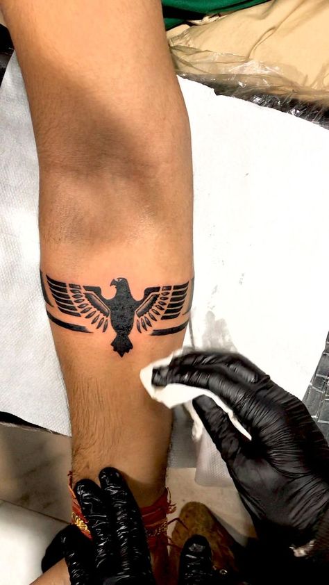 Eagle tattoo | eagle arm band tattoo | arm band tattoo | Arm band tattoo, Forearm band tattoos, Wrist tattoos for guys Eagle Arm Band Tattoo, Tattoo Arm Band, Small Eagle Tattoo, Tattoo Eagle, Band Tattoos For Men, Band Tattoos, Petit Tattoo, Forearm Band Tattoos, Band Tattoo Designs