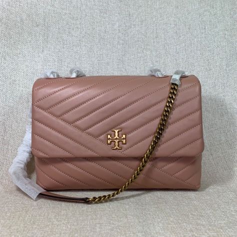 Brand New Never Been Carried. Fast Shipping. Receive In 2 - 3 Business Days. Meadowsweet Pink Kira Chevron Flap Shoulder Bag/Cross Body Bag By Tory Burch. This Bag Is Made Of Pink Leather. This Bag Is Convertible. Can Be Carried As A Shoulder Bag Or Cross Body Bag. Dimensions: 11" Wide Across Bottom X 7" Tall Center X 3" Deep. Strap Drop Doubled 12.5", Single 23". Interior: 2 Compartments. 1 Center Zipper Compartment. 2 Slip Pockets And 1 Zipper Pocket. Flap Closure Secured With Magnetic Button. Gold Shoulder Bag, Tory Burch Kira Chevron, Tory Burch Shoulder Bag, Kira Chevron, Slouchy Tote, Tory Burch Purse, Tory Burch Crossbody, Tory Burch Kira, Tan Handbags