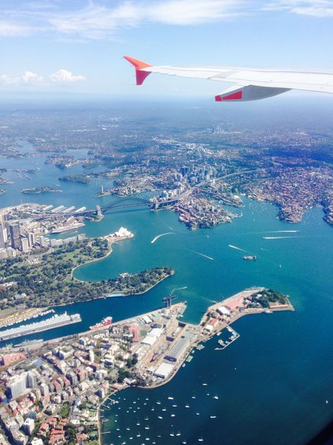 Flying over Sydney Harbor, Australia. Flying To Australia, Airplanes Aesthetic, Plane Window View, Plane View, Whatsapp Logo, Plane Window, Australia Vacation, Airplane Window, Sydney Harbour