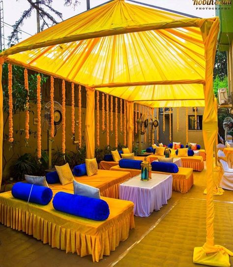 Mehendi decoration with yellow n navy blue ... #indianweddingblog #saree #designerblouse #teluguwedding #telugubride #tamilwedding #tamilbride #weddingbrigade #gorgeousbride #shopzters #shaadimagic #bridesessentials #ezwed #pellipoolajada #southindianbride #southindiaanwedding #templejewellery #southindianweddingdecor Haldi Gazebo Decor, Haldi Decorations, Mehendi Decoration, Wedding Cocktail Tables, Wedding Catering Menu, Haldi Decoration Ideas, Haldi Ceremony Decorations, Indian Wedding Decorations Receptions, Haldi Decoration