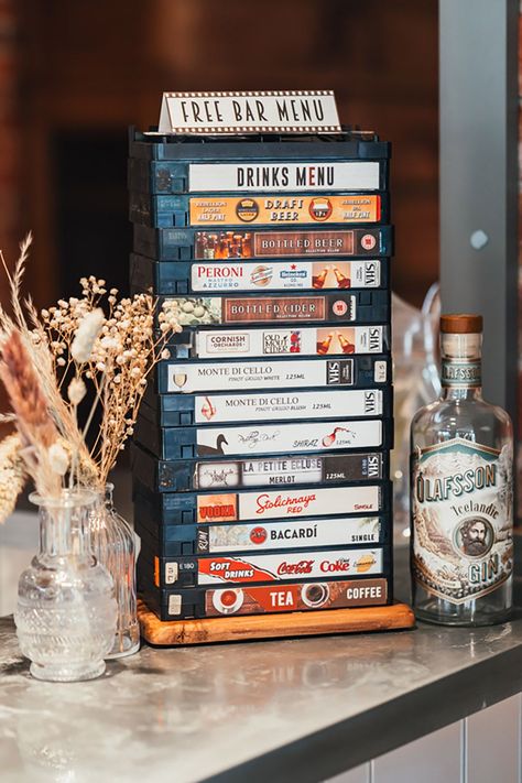 Unique wedding bar drinks menu sign made from old VHS tapes | Suzy Elizabeth Photography Wedding Ideas Movie Theme, Movie Wedding Aesthetic, Theater Themed Wedding, Film Themed Wedding, Wedding Vintage Theme, London Theme Wedding, Movie Theatre Wedding, Wedding Movie Theme, 90s Theme Wedding Reception