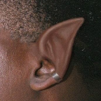 Brown Elf Ears, Elf Ears Aesthetic Male, Elf Bard Aesthetic, Fae Aesthetic Male, Black Elf Aesthetic, Black Elf Ears, Elf Aesthetic Male, Male Fairy Aesthetic, Black Elf Male