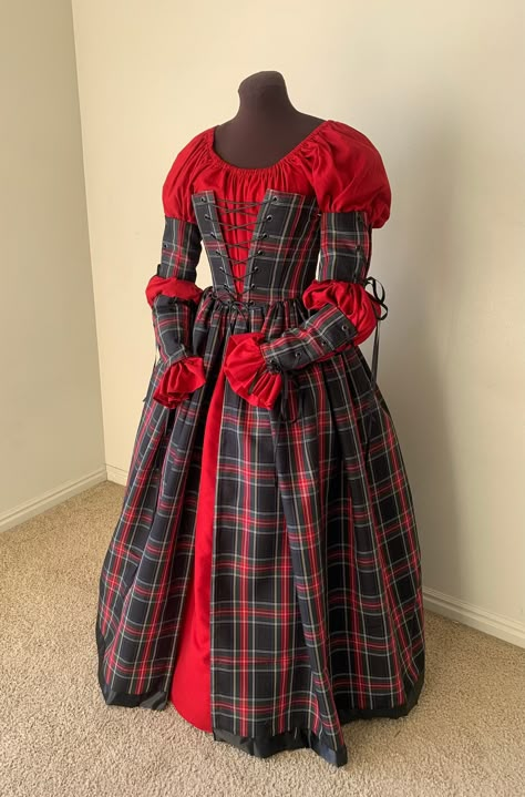 This is gown is ready  made and will be the merriest gown at this seasons' festivals!! The fabric is a medium weight woven plaid. The black Stewart plaid is black and green, with stripes of light blue, red and gold, The corset style bodice is fully lined and interlined, and boned at 9 intervals around the bodice, and double boned along the front closure of 14 black grommets.  The gathered overskirt is firmly attached to the bodice and is split down center front.  The bodice measurements are: 30 Plaid Dress Outfit Winter, Harlequin Fashion, Victorian Christmas Dress, Tartan Wedding Dress, Dickens Dress, Plaid Corset, Stewart Plaid, Irish Dress, Stewart Tartan