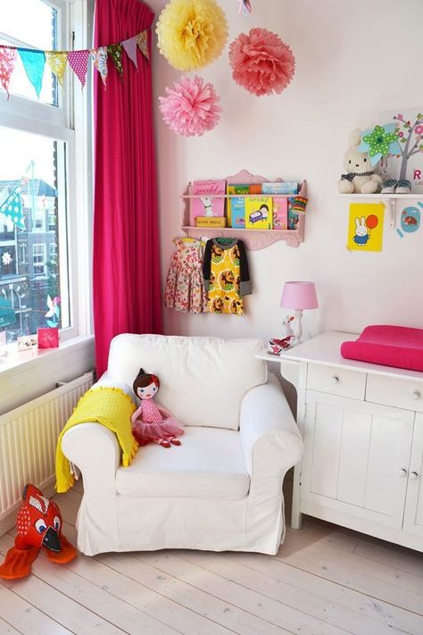 LOVING the touches of pink in this nursery in the Netherlands! What a sweet reading nook, too. /ES Pink Orange Nursery, Bright Pink Nursery, Orange Nursery, Eclectic Nursery, Kids Room Curtains, Baby Nursery Design, Nursery Tour, Colorful Nursery, Pink Dresser