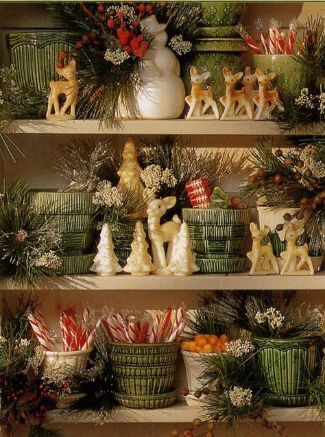 Vintage green flower pots and vintage deer candles Vintage Christmas Displays, Vintage Collection Display, Decorating Bookshelves For Christmas, Mccoy Pottery Display, Ceramic Christmas Tree Display, Christmas Shelf Decor Ideas, Displaying Dishes, Gurley Christmas Candles, Vintage Department Store Christmas