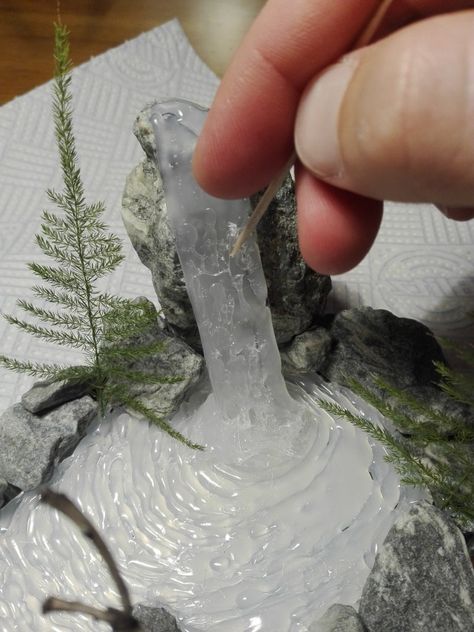 Hot Glue Waterfall, Crafts With Hot Glue, Diy Christmas Village Displays, Diy Waterfall, Dnd Crafts, Mini Waterfall, Christmas Tree Village, Rock Fountain, Christmas Village Accessories