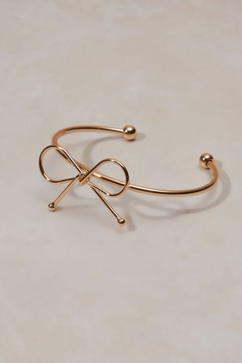 This bracelet seamlessly blends with your unique style. A delicate bow adorns the bracelet, a touch of playful whimsy that speaks to your free spirit. The open cuff design allows for a perfect fit.   Fit: Adjustable Closure: Slip on IMPORTED Cuff Design, Women's Bracelets, Charm Bangle, Bracelets For Women, Free Spirit, Charm Bracelets, Womens Bracelets, Cuff Bracelet, Unique Style