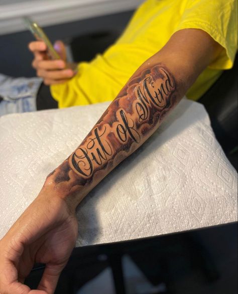 Tattoo Ideas For Side Of Arm, Tattoos That Signify Strength, Horizontal Forearm Tattoo, Name Design Tattoos, Est 2002 Tattoo, Forearm Name Tattoo Men, Out Of Sight Out Of Mind Tattoo, Medium Tattoos For Men, Name Tattoos For Men Forearm