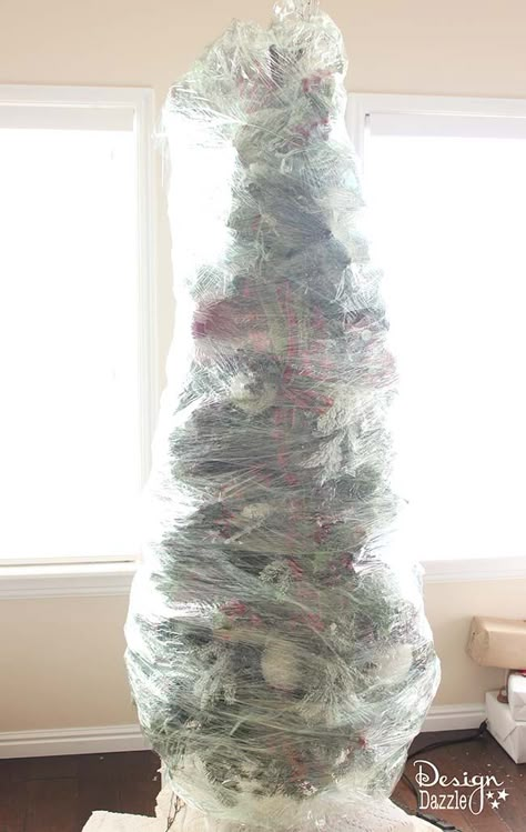 This year, wrap up your Christmas tree for easy storage! The BEST Christmas decorating and time-saving tip ever!! Wrap up your artificial DECORATED Christmas tree and store for next year. No putting away your ornaments and taking down the tree. LOVE this idea! Design Dazzle Storing Christmas Tree, Diy Christmas Tree Storage, Christmas Tree Storage Ideas, Holiday Decor Storage Ideas, Ribbon On Tree, Christmas Storage Ideas, Christmas Tree Wrap, Winter Wonderland Crafts, Store Christmas Tree